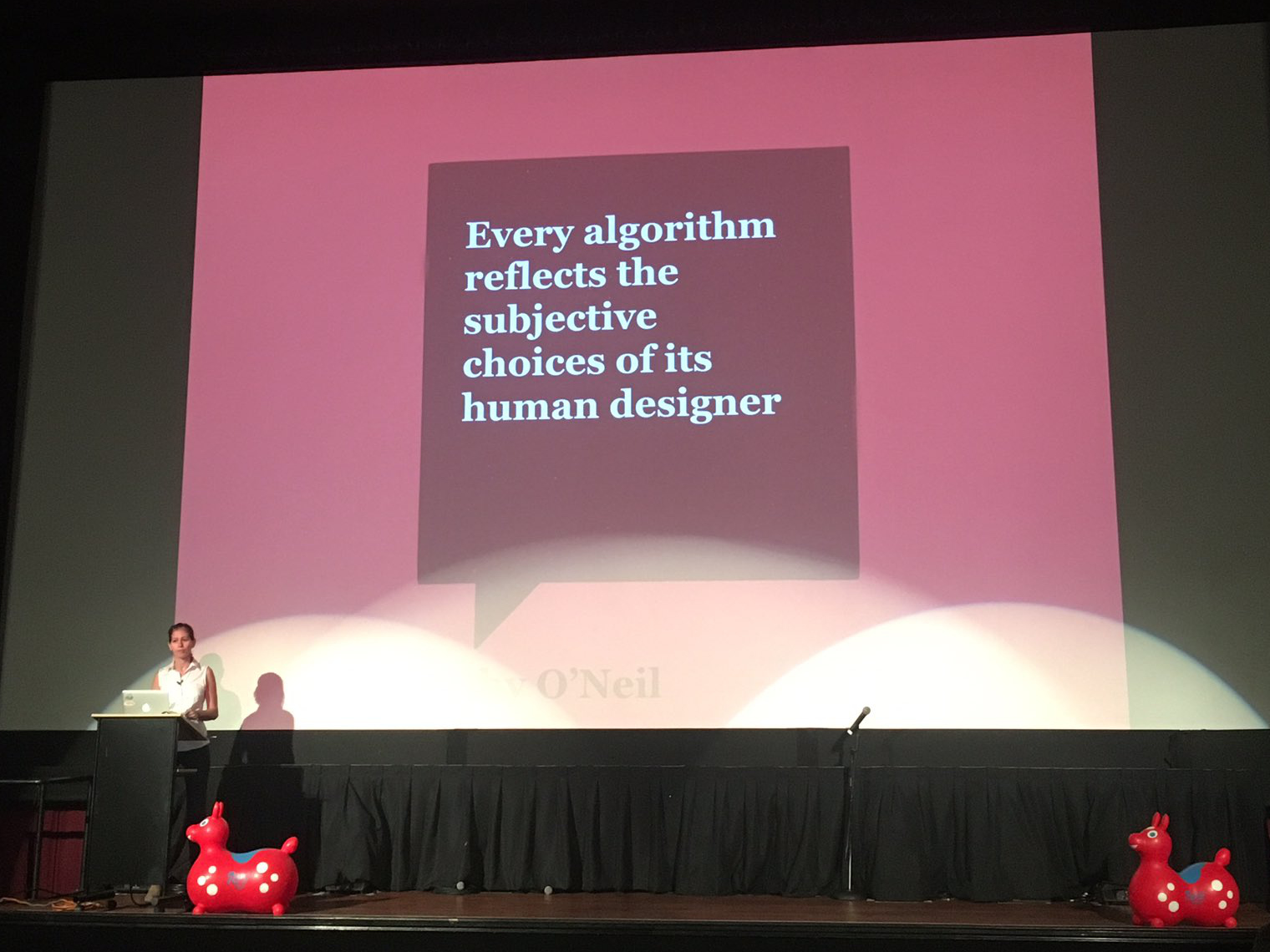 Elle presenting at Keep Ruby Weird, with a slide showing the above quote from O'neill
